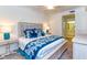 Spacious main bedroom with king-size bed and en-suite bathroom at 17520 Gawthrop Dr # 102, Bradenton, FL 34211