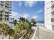 Grounds with tropical landscaping and partial ocean view at 1770 Benjamin Franklin Dr # 204, Sarasota, FL 34236