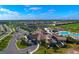 Aerial view showcasing community amenities: clubhouse, pool, tennis courts at 17724 Gawthrop # 103, Bradenton, FL 34211