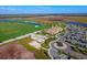 Aerial view of community with clubhouse, pool, golf course, and tennis courts at 17724 Gawthrop # 103, Bradenton, FL 34211