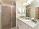 Clean bathroom with a walk-in shower and quartz countertop at 17724 Gawthrop # 103, Bradenton, FL 34211