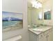 Clean bathroom with a vanity, large mirror, and updated fixtures at 17724 Gawthrop # 103, Bradenton, FL 34211