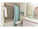 Bathroom with a shower/tub combo, toilet and white vanity at 17724 Gawthrop # 103, Bradenton, FL 34211