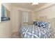 Bright bedroom with a comfy bed and nautical-themed decor at 17724 Gawthrop # 103, Bradenton, FL 34211