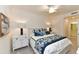 Main bedroom with ceiling fan and white dresser at 17724 Gawthrop # 103, Bradenton, FL 34211