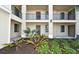 Condo building with lush landscaping and private entryways at 17724 Gawthrop # 103, Bradenton, FL 34211