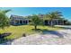 Luxury clubhouse with lush landscaping and palm trees at 17724 Gawthrop # 103, Bradenton, FL 34211