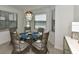 Charming dining area with round table and six wicker chairs at 17724 Gawthrop # 103, Bradenton, FL 34211