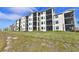 Modern building exterior with balconies and landscaping at 17724 Gawthrop # 103, Bradenton, FL 34211