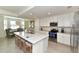 Modern kitchen with white cabinets and a large island at 17724 Gawthrop # 103, Bradenton, FL 34211