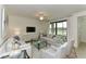 Spacious living room with comfy sofas and a large TV at 17724 Gawthrop # 103, Bradenton, FL 34211