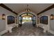 Elegant lobby with stone benches and arched entryway leading to courtyard at 17724 Gawthrop # 103, Bradenton, FL 34211