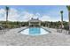 Community pool with a relaxing patio area at 17724 Gawthrop # 103, Bradenton, FL 34211