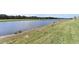 Serene lakefront property with grassy areas at 17724 Gawthrop # 103, Bradenton, FL 34211