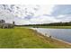 Scenic view of a peaceful lake and lush green landscape at 17724 Gawthrop # 103, Bradenton, FL 34211