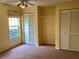 Bedroom with window, carpet, and double closets at 1803 Ashley Dr, Venice, FL 34292