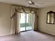 Bright bedroom with window, carpet, and double closets at 1803 Ashley Dr, Venice, FL 34292