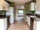 View of kitchen with stainless steel appliances and a breakfast bar at 1803 Ashley Dr, Venice, FL 34292
