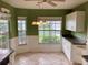 Kitchen nook with white cabinets and a view of the backyard at 1803 Ashley Dr, Venice, FL 34292