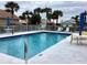 Community pool with surrounding patio furniture at 1803 Ashley Dr, Venice, FL 34292