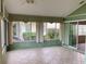 Sunroom with tiled flooring and access to the outdoors at 1803 Ashley Dr, Venice, FL 34292