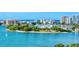 An aerial view of a beautiful waterfront community with lush landscaping at 240 Sands Point Rd # 4201, Longboat Key, FL 34228