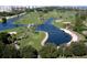 Aerial view of lush golf course with ponds and walking paths at 240 Sands Point Rd # 4201, Longboat Key, FL 34228