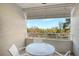 Balcony with table and chairs overlooking ocean at 240 Sands Point Rd # 4201, Longboat Key, FL 34228