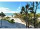 Beachfront view with palm trees and ocean at 240 Sands Point Rd # 4201, Longboat Key, FL 34228