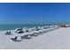 Relaxing beach scene with lounge chairs and umbrellas at 240 Sands Point Rd # 4201, Longboat Key, FL 34228