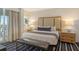 Main bedroom with a king-size bed and stylish furnishings at 240 Sands Point Rd # 4201, Longboat Key, FL 34228