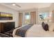 King bedroom with TV, balcony access and stylish decor at 240 Sands Point Rd # 4201, Longboat Key, FL 34228