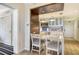 Small dining area with kitchen and living room views at 240 Sands Point Rd # 4201, Longboat Key, FL 34228