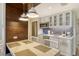 Well-equipped kitchen with breakfast bar and modern cabinetry at 240 Sands Point Rd # 4201, Longboat Key, FL 34228