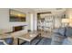 Living room with sofa, coffee table and view into the kitchen at 240 Sands Point Rd # 4201, Longboat Key, FL 34228