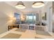 Living room features comfortable seating and sliding glass doors to balcony at 240 Sands Point Rd # 4201, Longboat Key, FL 34228