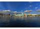 Waterfront view of a marina and cityscape under a bright sky at 240 Sands Point Rd # 4201, Longboat Key, FL 34228