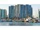 Luxury yachts and modern high-rise building in a marina setting at 240 Sands Point Rd # 4201, Longboat Key, FL 34228
