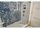 Walk-in shower with herringbone tile and glass enclosure at 240 Sands Point Rd # 4201, Longboat Key, FL 34228