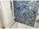 Walk-in shower with herringbone tile and glass enclosure at 240 Sands Point Rd # 4201, Longboat Key, FL 34228