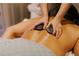 Relaxing hot stone massage in a tranquil spa setting at 240 Sands Point Rd # 4201, Longboat Key, FL 34228