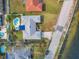 Aerial view showing house, pool, and waterfront location at 2425 Riverview Blvd, Bradenton, FL 34205