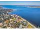 Wide aerial showcasing waterfront community and homes along the coast at 2425 Riverview Blvd, Bradenton, FL 34205