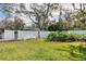 Large backyard with a white fence and shed at 2425 Riverview Blvd, Bradenton, FL 34205