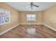 Roomy bedroom featuring neutral walls and a ceiling fan at 2425 Riverview Blvd, Bradenton, FL 34205