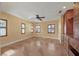 Large bedroom with built-in dresser and ceiling fan at 2425 Riverview Blvd, Bradenton, FL 34205