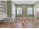 Bedroom with built-in shelving and window shutters at 2425 Riverview Blvd, Bradenton, FL 34205