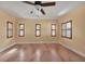 Bright bedroom with multiple windows and ceiling fan at 2425 Riverview Blvd, Bradenton, FL 34205