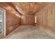 Spacious bonus room with wood paneling and ceiling fans at 2425 Riverview Blvd, Bradenton, FL 34205