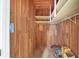 Shelved closet with wood paneling and carpeted floor at 2425 Riverview Blvd, Bradenton, FL 34205